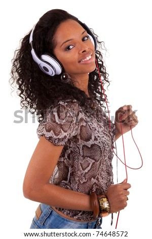 stock photo : Young beautiful black woman listening to music