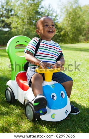 Cute little african american baby boy playing at park