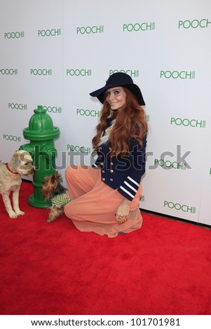 LOS ANGELES, CA - MAY 3: Phoebe Price, dog Henry at the opening of the Pooch Hotel on May 3, 2012 in Hollywood, Los Angeles, CA. The Pooch Hotel is a luxury hotel and daycare exclusively for dogs.