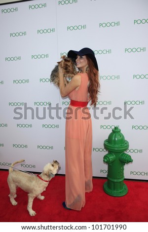LOS ANGELES, CA - MAY 3: Phoebe Price, dog Henry at the opening of the Pooch Hotel on May 3, 2012 in Hollywood, Los Angeles, CA. The Pooch Hotel is a luxury hotel and daycare exclusively for dogs.