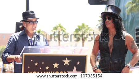 LOS ANGELES - JUL 10: Slash, Charlie Sheen at a ceremony where Slash is honored with the 2,473rd Star on the Hollywood Walk of Fame on July 10, 2012 in Los Angeles, California