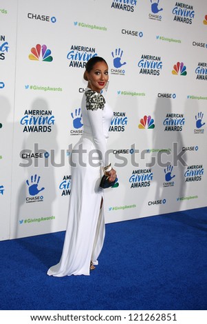 LOS ANGELES - DEC 7:  Adrienne Bailon arrives to the 2012 American Giving Awards at Pasadena Civic Center on December 7, 2012 in Pasadena, CA