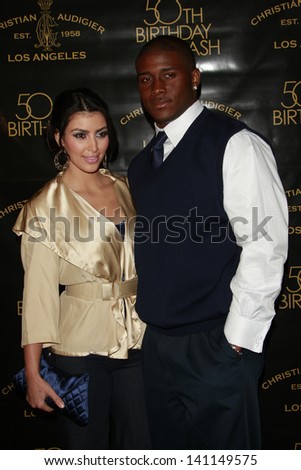 LOS ANGELES - MAY 23: Kim Kardashian, Reggie Bush arrive to Designer Christian Audigier`s 50th Birthday Bash at the Peterson Automotive Museum on May 23, 2008 in Los Angeles, California