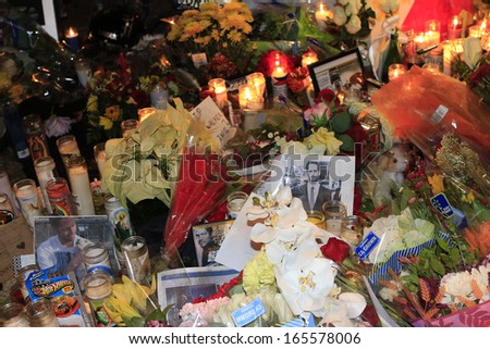 SANTA CLARITA - DEC 1: Fans pay tribute to actor Paul Walker at the site of his fatal car accident on December 1, 2013 in Santa Clarita, California