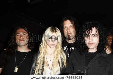 LOS ANGELES - APR 9:  Taylor Momsen with her band \'The Pretty Reckless\' at the Vans Warped Tour 2010 Press Conference and Kick-Off Party, Key Club, Los Angeles, California on April 9, 2010.
