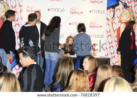 COSTA MESA - DEC 8: Stacy Ferguson aka Fergie launches her handbag collection for Kipling and signs autographs for her fans at Macy\'s in Costa Mesa, California December 8, 2007.