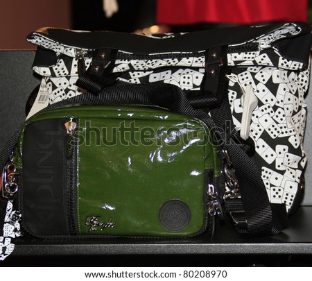 COSTA MESA - DEC 8: Stacy Ferguson aka Fergie launches her handbag collection for Kipling - these are some of her bags at Macy's on December 8, 2007  in Costa Mesa, California.