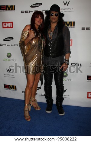 LOS ANGELES, CA - FEB 13: Slash & Perla Hudson at the EMI GRAMMY After-Party at Milk Studios on February 13, 2011 in Los Angeles, California