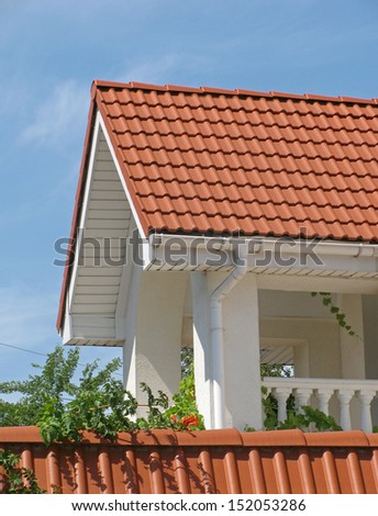 balcony of cottage with red tiled roof