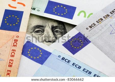 euro vs dollars: Franklin stare through space between euro banknotes