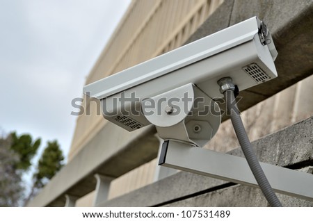 security camera on wall of a building
