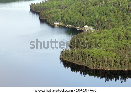 plane view of a fishing camp in a wild forest