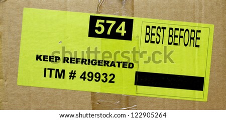 yellow sticker food tag over carton box