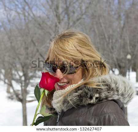 winter woman with a red rose