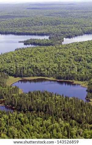 aerial landscape of a lake and forest in northern quebec