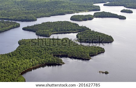 aerial wild forest and lake in northern quebec canada