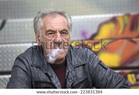 handsome old italian man smoking