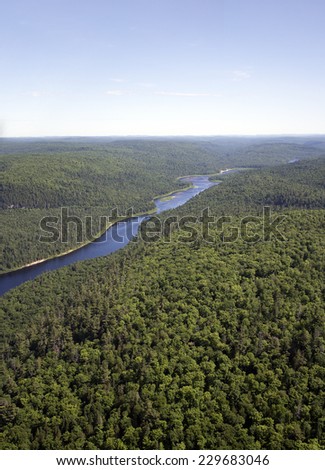 aerial landscape of a river and forest in northern quebec
