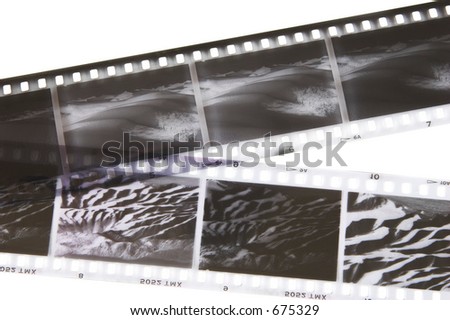 Black and white negative film strips of desert scenes