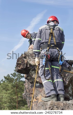 Stary Plzenec, Czech Republic, June 3, 2014: training rescue team. Rescue in rocky terrain near the castle RADYNE.