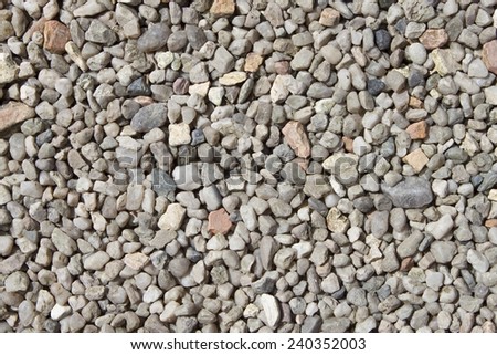 Crushed granite and pebble gravel texture, background, closeup