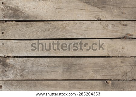 Wiev of old wood planks, horizontally arranged. Wooden background. Pallet carrier or rack.