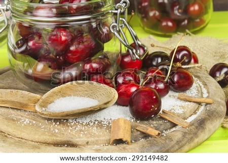 Domestic production of cherry jam. Freshly picked cherries ready for canning. The supply of fruits for the winter and a rainy day. The preparation of sweets for the family.