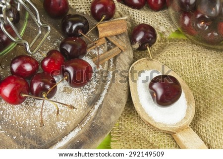 Domestic production of cherry jam. Freshly picked cherries ready for canning. The supply of fruits for the winter and a rainy day. The preparation of sweets for the family.