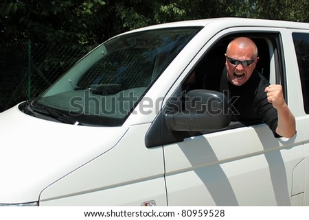 angry driver cursing, aggressive driver of the big white car, black shirt