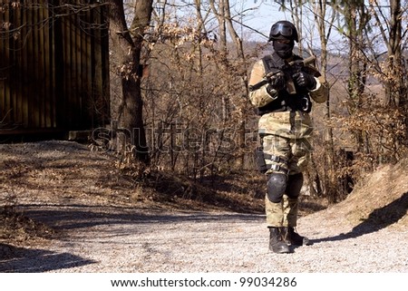 special police unit, masked police officer with a weapon
