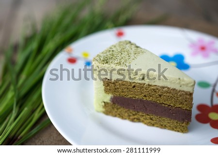 Cake make form green tea and red nut is homemake cake