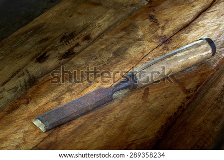 Old chisel in vintage wood tools for carpenter