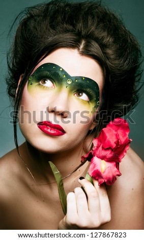 Girl with a pretty face and red flowers