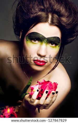 Girl with a pretty face and red flowers
