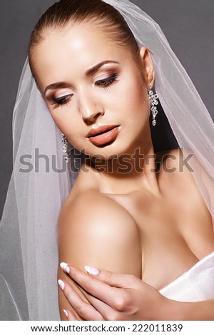 Portrait of a young beautiful bride with veil
