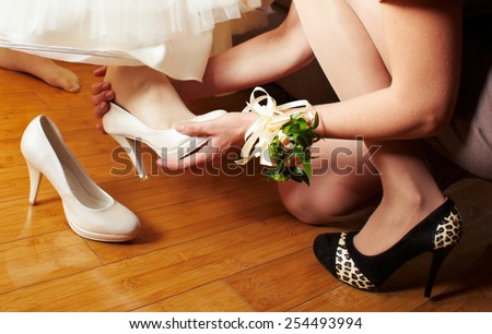 Bridesmaid dress slipper on the foot bride