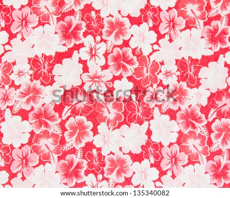 Alternating red and white flower pattern on the cloth.