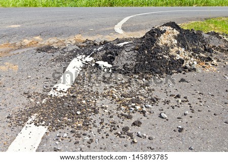 Asphalt surface, the curve of the road were demolished due to poor construction.