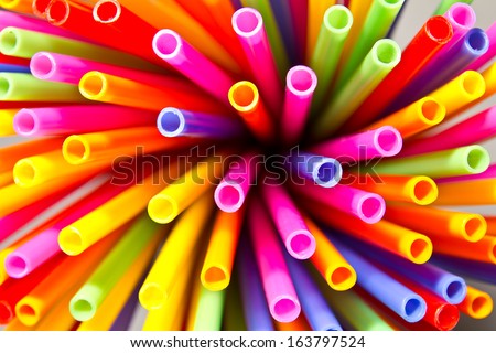 Close-up above many colorful plastic tubes twisted into a circle