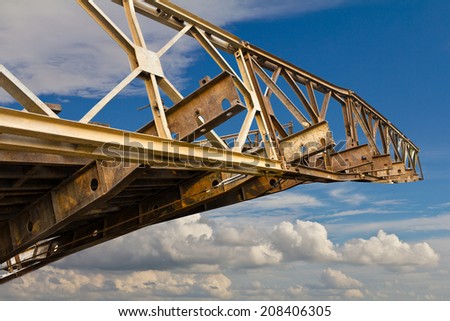 Old iron bridge was damaged in the accident filed to the sky.