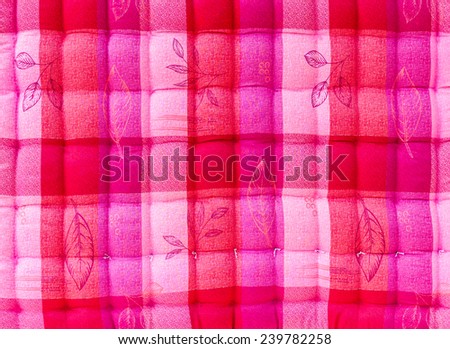 Close up background beautiful pink and white corrugated bed quilt.