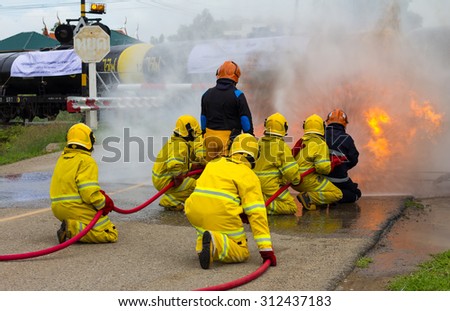 Team Thailand firefighters extinguished the blaze, flames, smoke close to the train tanker, which is dangerous.