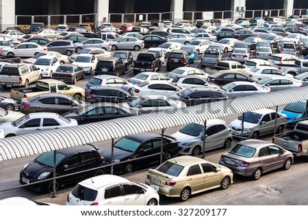 BANGKOK THAILAND-JUNE 19:\
View above the parking lot where cars are parked everywhere across the Chatuchak Park.On June 19, 2015 in Bangkok, \
Thailand.