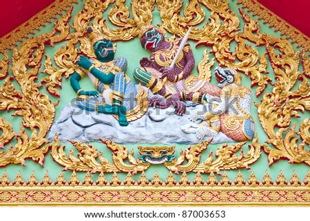 Art Ramayana story stucco church in front of Thailand temple.