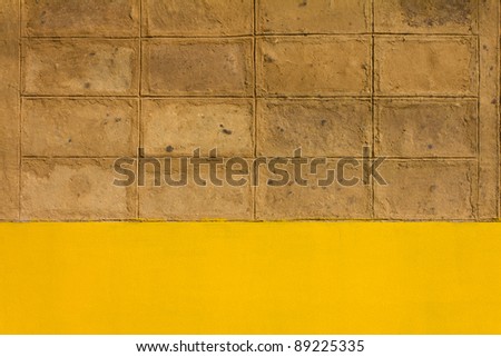 Walls of brown clay. Walls of brown clay. Located on the cement walls are yellow.