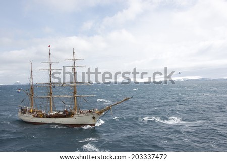 Sailboat with three masts in the waters of the Southern Ocean, Antarctica