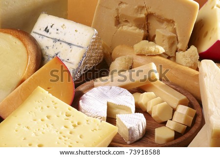 stock-photo-assorted-cheeses-in-various-shapes-and-sizes-73918588.jpg