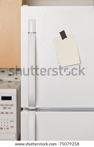 Piece of yellow paper taped to a refrigerator door