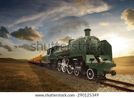 vintage green and yellow steam powered railway train