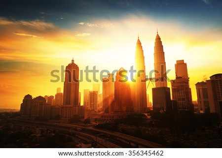 Sunrise in Kuala Lumpur with the silhouette of the Kuala Lumpur city skyline
